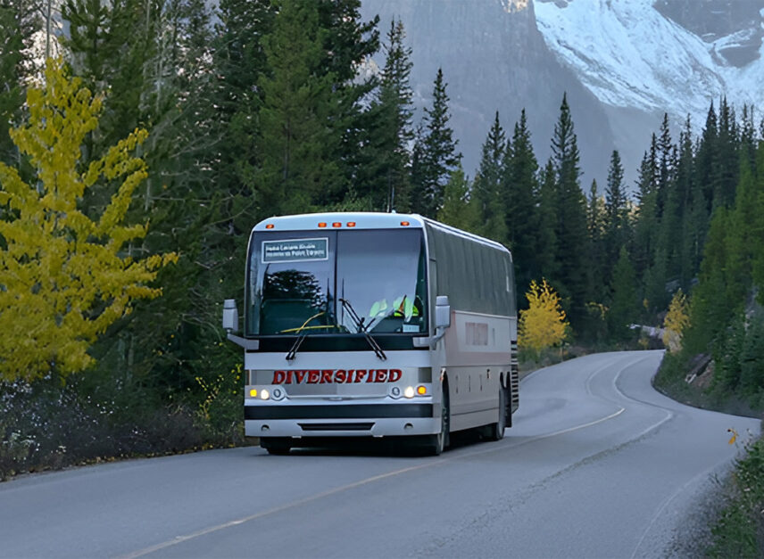 Shuttle bus arriving at Moraine Lake Lodge, transporting guests to the beautiful lodge nestled in the heart of Banff National Park, offering a convenient and scenic way to experience the area.